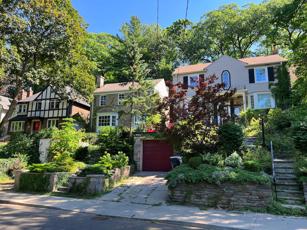 Tree-lined street with large detached homes in The Beaches, Toronto — Clean Papi service area